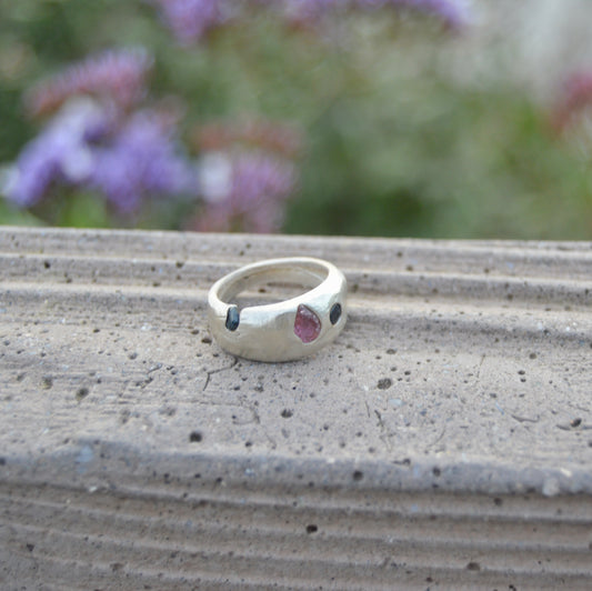 Dome ring with blue sapphires and rough cut garnet size 6